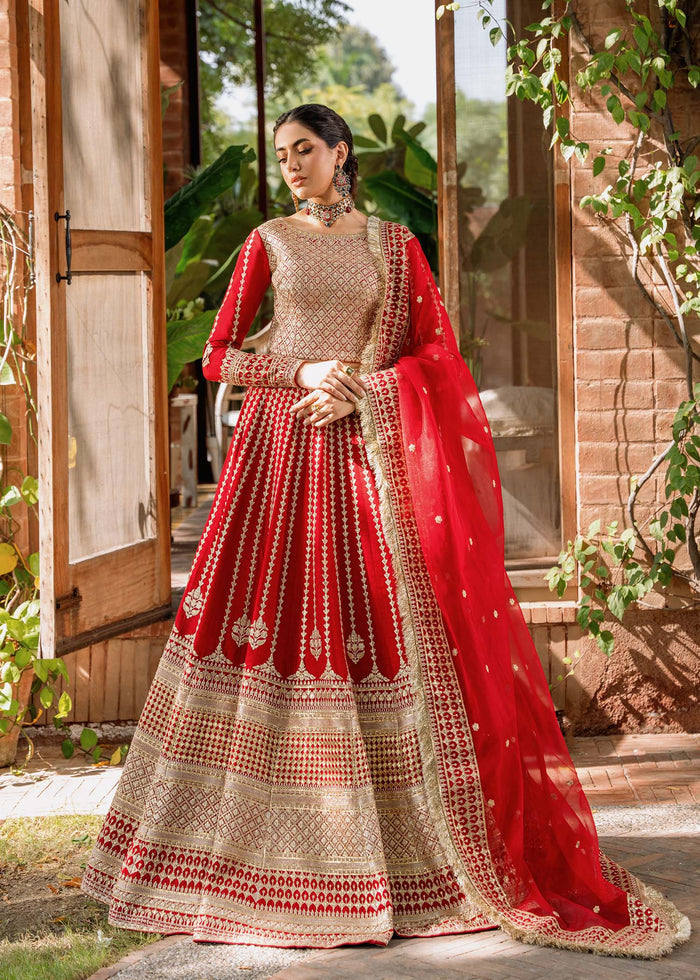 nikkah dress red Luxury Pakistani Bridal Dress for Wedding, Nikkah & Reception Introducing Zar-e-Maroon, where golden craftsmanship meets timeless South Asian elegance. This breathtaking reddish maroon bridal couture is crafted on premium Shisha Silk, featuring