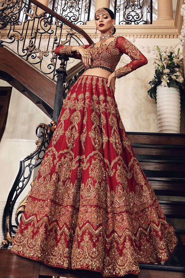 Uroos-e-Khas — A vision of opulence and grace, this masterpiece celebrates the grandeur of timeless bridal heritage. Rich crimson tones meet intricate hand-embellished artistry, woven with shimmering embellishments to create a silhouette that whispers of royal charm. Each detail tells a story of elegance, designed for the bride who wishes to embody both tradition and allure on her most special day.