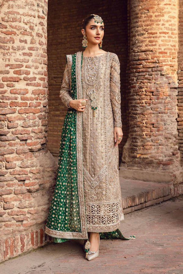 Woman in traditional outfit standing against a brick wall Widad - MC-1015 pakistani indian wedding bridal dress, mehndi nikkah oufits guest suits
